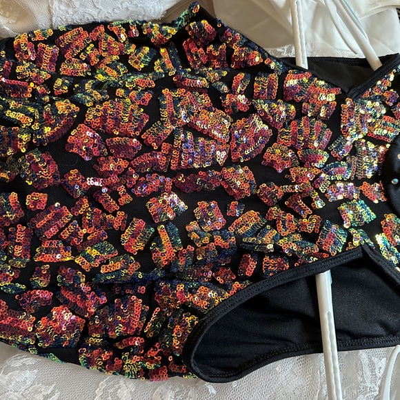 BLACK MOCK NECK BIKETARD WITH SHEER MESH AND IRIDESCENT SEQUIN DETAILING - Picture 11 of 11